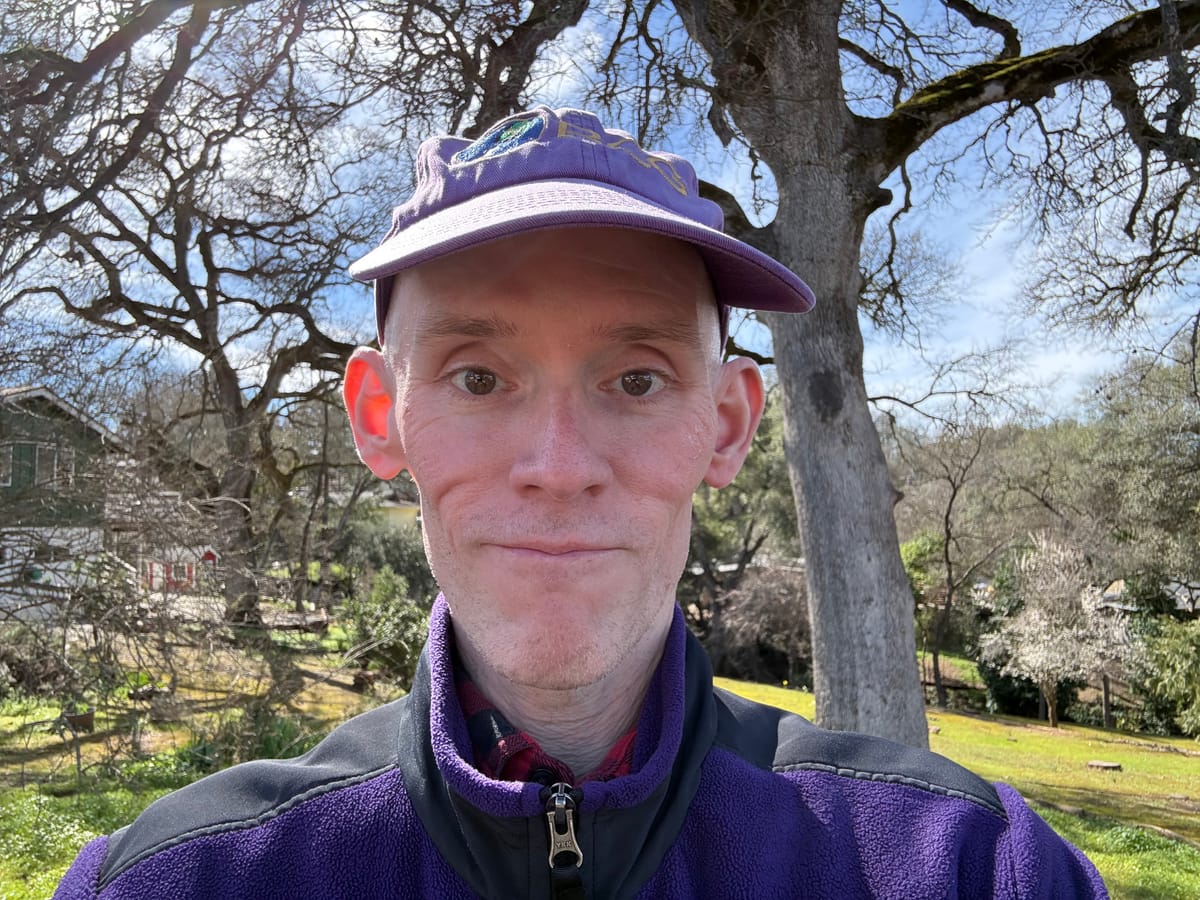 Eric Butow smiling while walking in his neighborhood in Jackson, California.